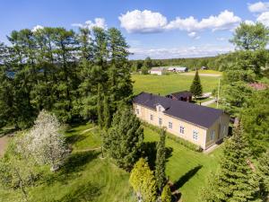 an overhead view of a large house in a field at Haapala Brewery restaurant and accommodation in Vuokatti