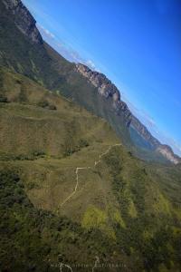 a mountain with a trail on the side of it at Camping Permacultural Filhos da Floresta in Vale do Capao