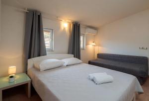 Posteľ alebo postele v izbe v ubytovaní Apartments Habek