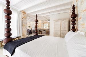 Un pat sau paturi într-o cameră la Villa Pela