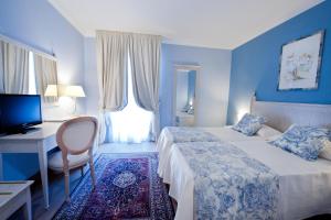 Voodi või voodid majutusasutuse OSTUNI PALACE - Hotel Bistrot & SPA toas