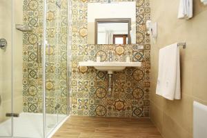 a bathroom with a sink and a shower at Ninni e Fede in San Vito lo Capo