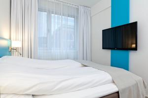 TV a/nebo společenská místnost v ubytování MediInn Hotel Oslo