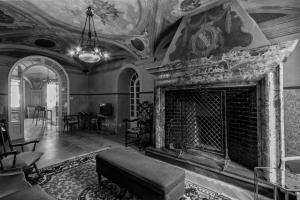a living room with a fireplace and a couch at Mediterraneo Emotional Hotel & Spa in Santa Margherita Ligure