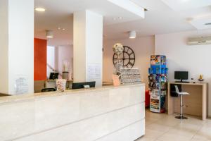 a lobby of a store with a cash counter at Hotel Rubens in Rimini