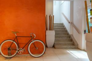 a bike parked in a hallway next to a staircase at Hotel Rubens in Rimini