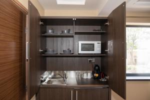 Kuchyň nebo kuchyňský kout v ubytování Grainger Apartments