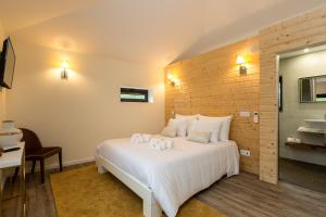 Quinta Do Rio tesisinde bir odada yatak veya yataklar
