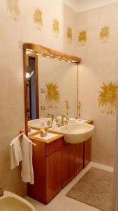 a bathroom with a sink and a mirror at B&B Le Rose in Siderno Marina +62 photos