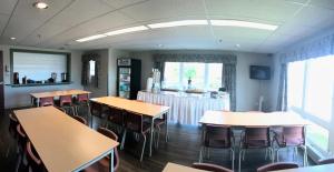 a classroom with tables and chairs in a room at Glendenning Hall at Holland College in Charlottetown