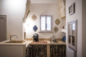 Kuchyň nebo kuchyňský kout v ubytování Al Caveau - Holiday House