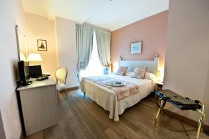 Voodi või voodid majutusasutuse OSTUNI PALACE - Hotel Bistrot & SPA toas