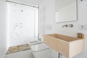 a bathroom with a sink and a toilet and a shower at Dimora Talenti in Polignano a Mare