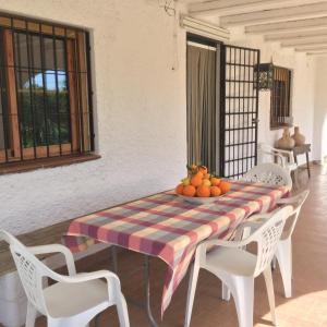 a table with a bowl of fruit on it at El cortijo de la abuela in Benahadux