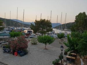 a parking lot with a marina with boats at Vathy Studios in Meganisi