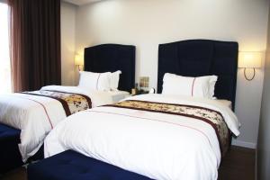 Postel nebo postele na pokoji v ubytování Hotel Brais