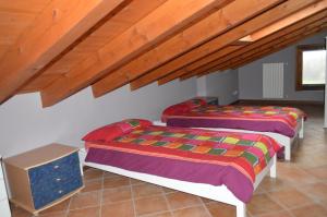 Postel nebo postele na pokoji v ubytování Il Melograno b&b Apartament + 20 fotografií