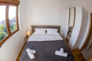 Krevet ili kreveti u jedinici u okviru objekta Porto Apartmani