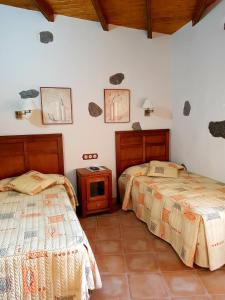 Een bed of bedden in een kamer bij El Rinconcito de Tejeda