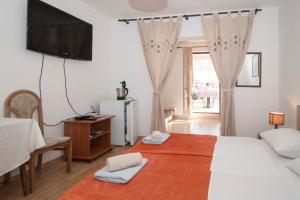 Postel nebo postele na pokoji v ubytování Rooms and apartments PALMA B&B