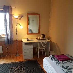 Postel nebo postele na pokoji v ubytování Wilhelmsen Romutleie
