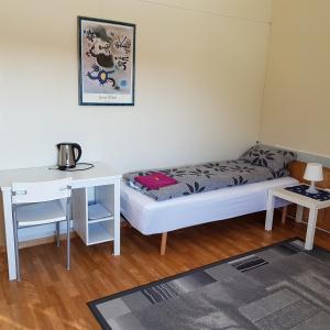 Postel nebo postele na pokoji v ubytování Wilhelmsen Romutleie
