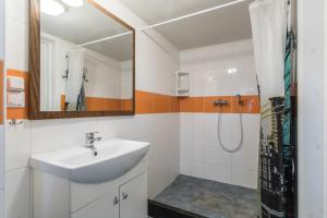 a bathroom with a sink and a shower at Undinėlė in Šventoji +141 photos