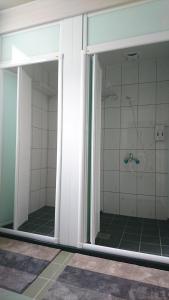 a bathroom with a shower stall and a walk in shower at Zhu Feng Hotel in Zhunan