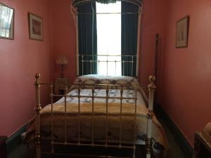 A bed or beds in a room at Vine Hill Villa