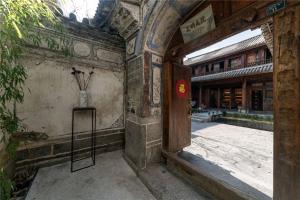 an entrance to an old building with an open door at Dali Old Courtyard Boutique Inn in Dali