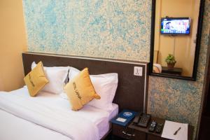 Una cama o camas en una habitación de Hotel Lapha