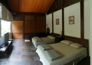 
A bed or beds in a room at Bright Moon Homestay
