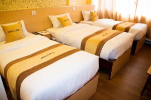Una cama o camas en una habitación de Hotel Lapha