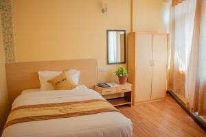 Una cama o camas en una habitación de Hotel Lapha