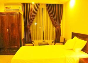 Postel nebo postele na pokoji v ubytování Aries Hotel