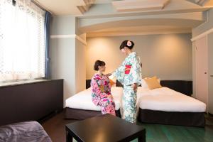 Postel nebo postele na pokoji v ubytování Hotel In Kyoto Sasarindou + 37 fotografií