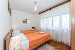 Postel nebo postele na pokoji v ubytování Apartment Promona Drniš