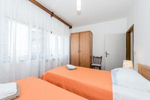 Postel nebo postele na pokoji v ubytování Apartment Promona Drniš