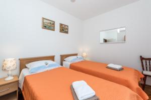 Postel nebo postele na pokoji v ubytování Apartment Promona Drniš