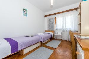 Postel nebo postele na pokoji v ubytování Apartment Promona Drniš