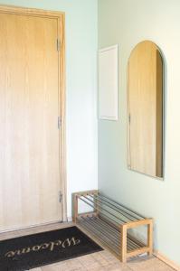 a room with a wooden cabinet and a rug at Pärnu Sadama 4 Street Apartment in Pärnu