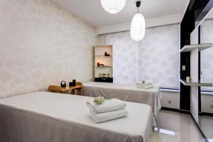 Posteľ alebo postele v izbe v ubytovaní Hotel Tami Residence