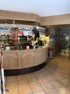 a lobby with a counter in a store at Albergo La Bicocca in Paneveggio