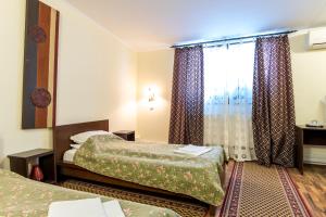 Un pat sau paturi într-o cameră la Hotel Corso