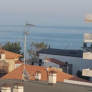 a view of the ocean from the roofs of buildings at allery in Alba Adriatica