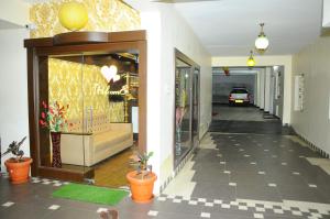 a hallway of a building with a store at Hotel Lovely Nest in Coimbatore