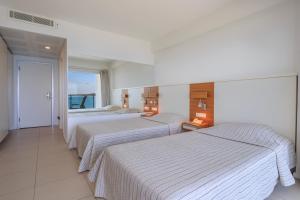 Postel nebo postele na pokoji v ubytování Hotel Delta