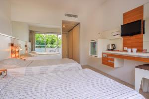 Postel nebo postele na pokoji v ubytování Hotel Delta