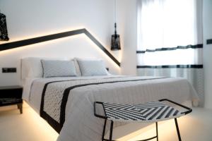 Ένα ή περισσότερα κρεβάτια σε δωμάτιο στο Divelia Hotel