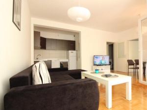 a living room with a couch and a table at Apartment Ema in Trebinje